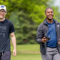 Dan Vainner and another participant smile and laugh